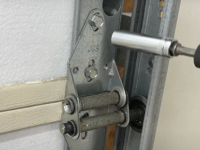 Tightening garage door bracket screws