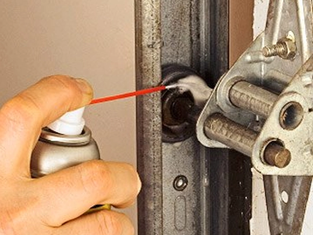 Lubricating a garage door roller