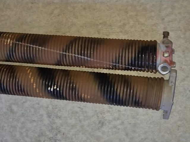 Rusted garage door spring inspected by a SnapDoor technician in Perth
